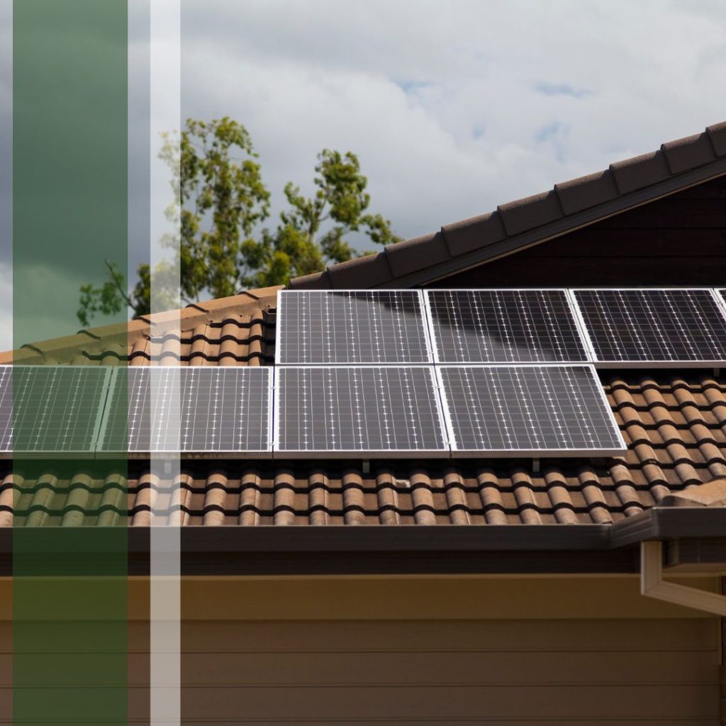 Solar panels sitting on a tile roof