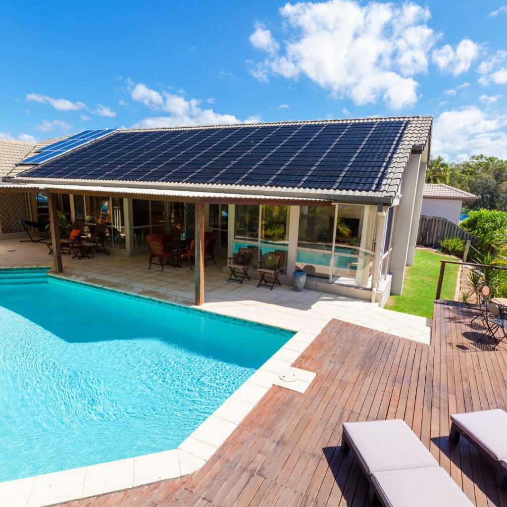Solar panels on a roof by a pool
