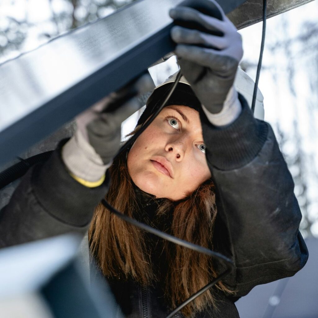 person working on a solar panel installation